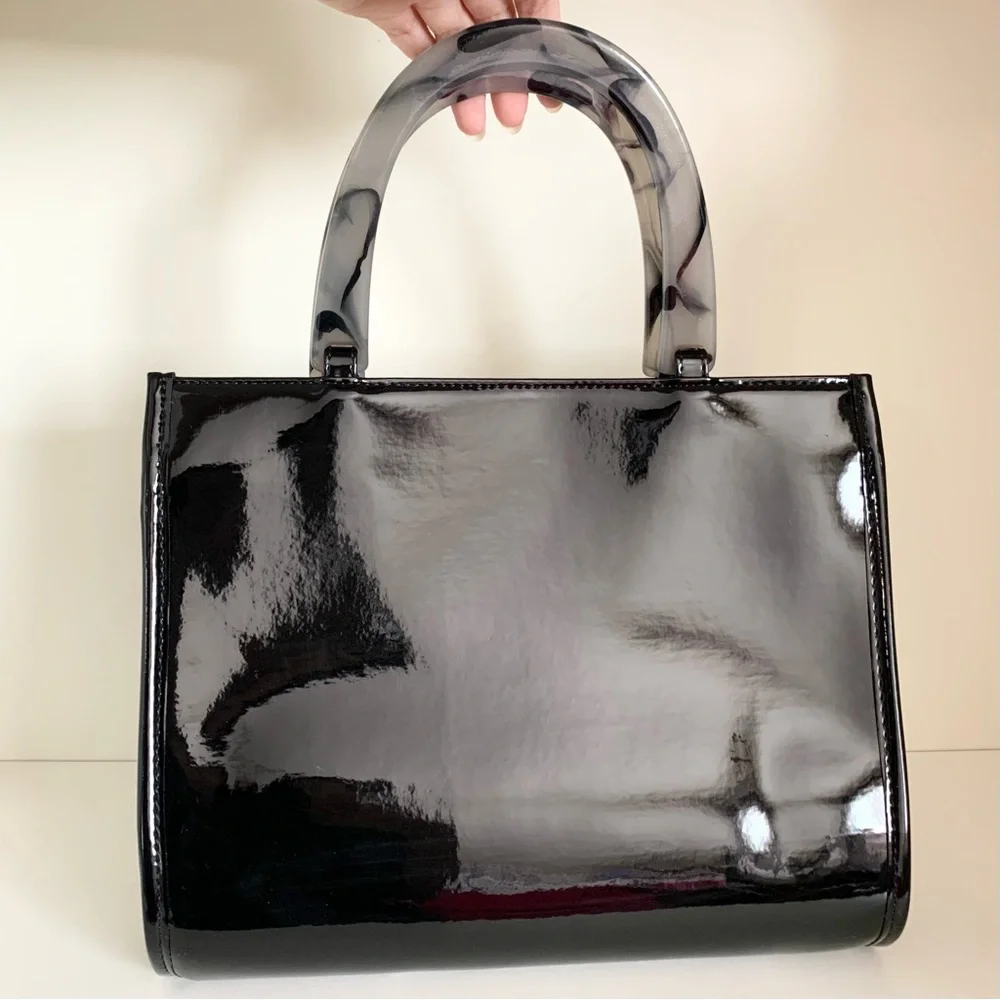 Hold NWOT Neiman Marcus black patent marble handle modern bag